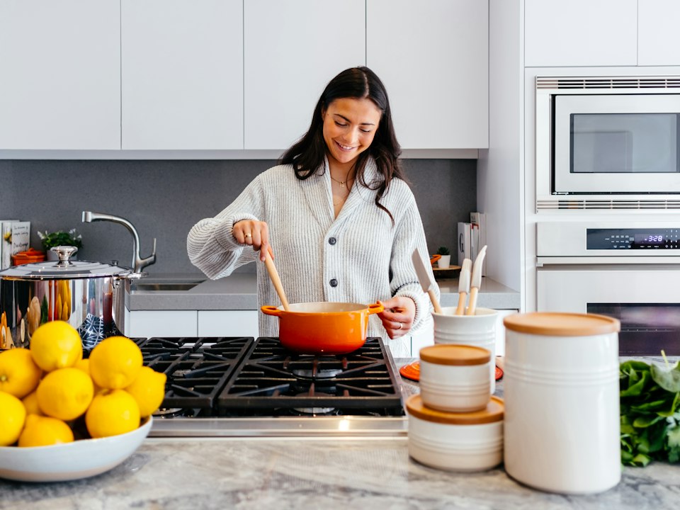 Person cooking in a home kitchen
