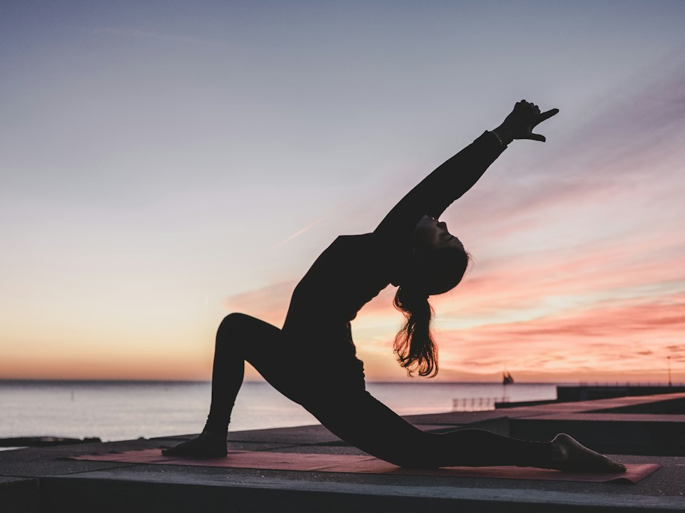 Person practicing yoga on a mat